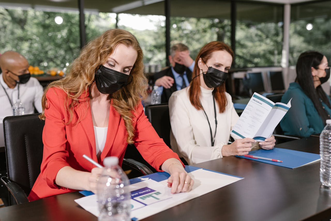 Participants of a Conference in Face Masks